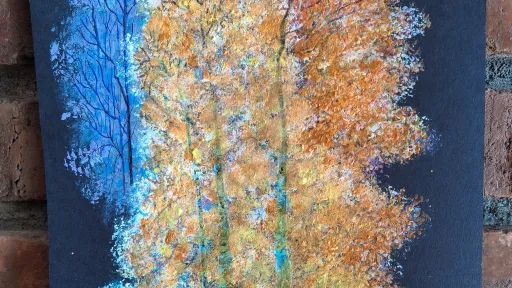 Acrylic and water color painting of tree transitions from blue to orange